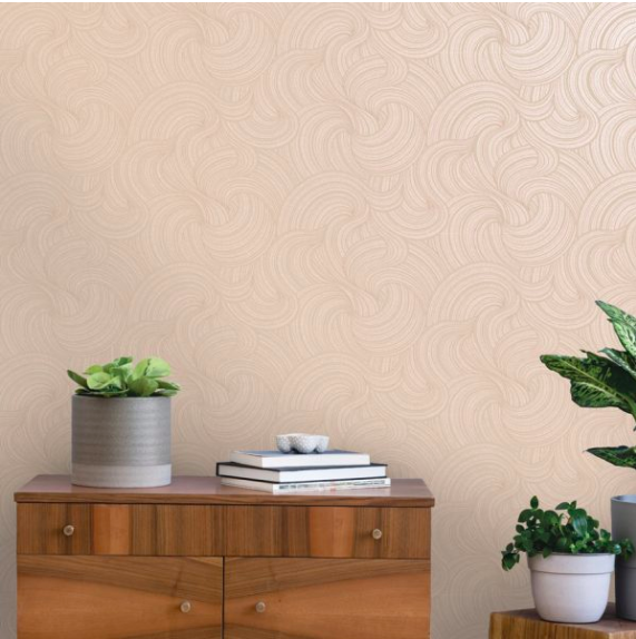 Light pink wall covering with textured swirls and metallic shine to the wallpaper. 