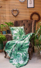 Create a tropical theme with palm cushion